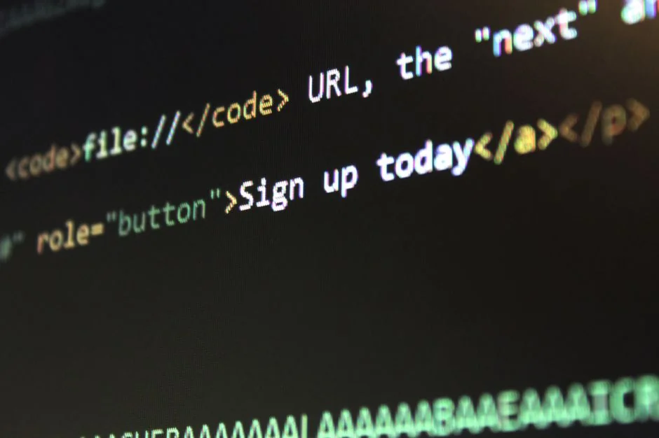 A miniature shopping cart placed on a laptop keyboard symbolizing online shopping and e-commerce.